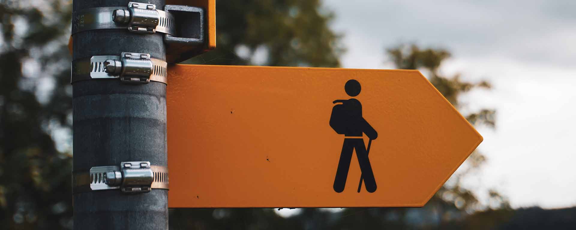 Street sign showing a stick figure person of a hiker