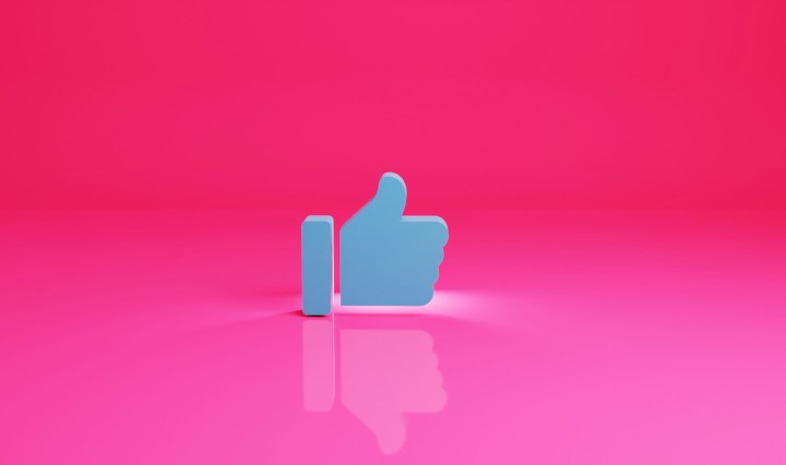 A 'thumbs up' emotion against a pink background