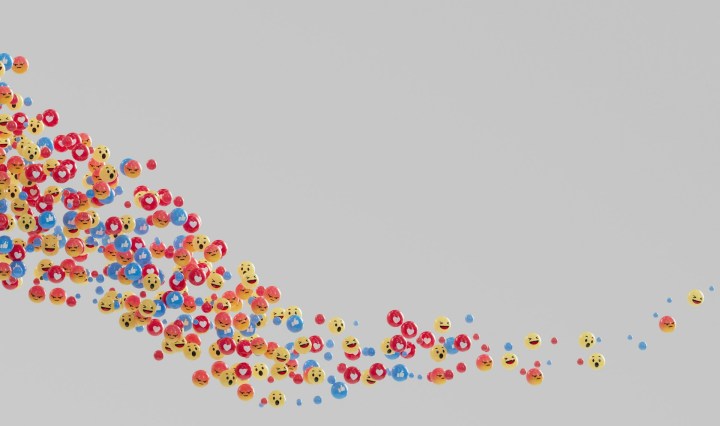 Heart and smiley face emoticons flot through space