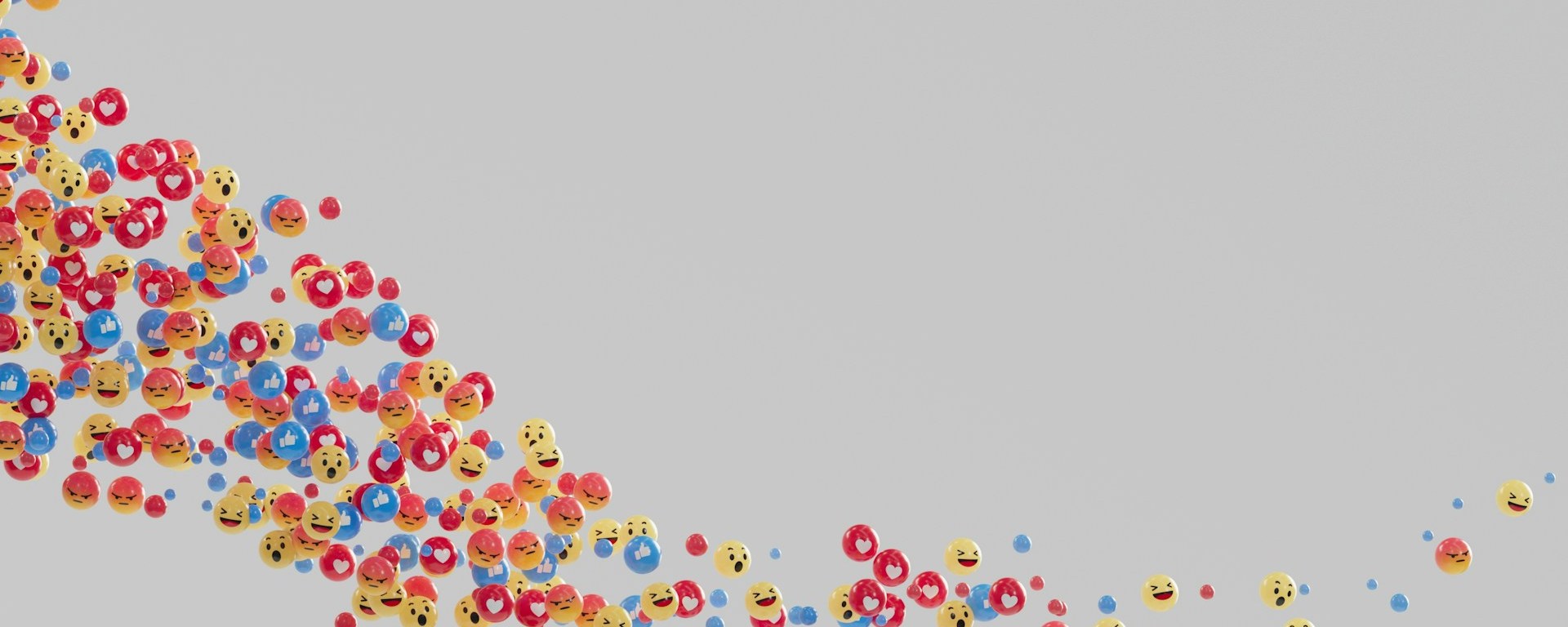 Heart and smiley face emoticons flot through space