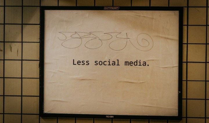 A sign says Less social media
