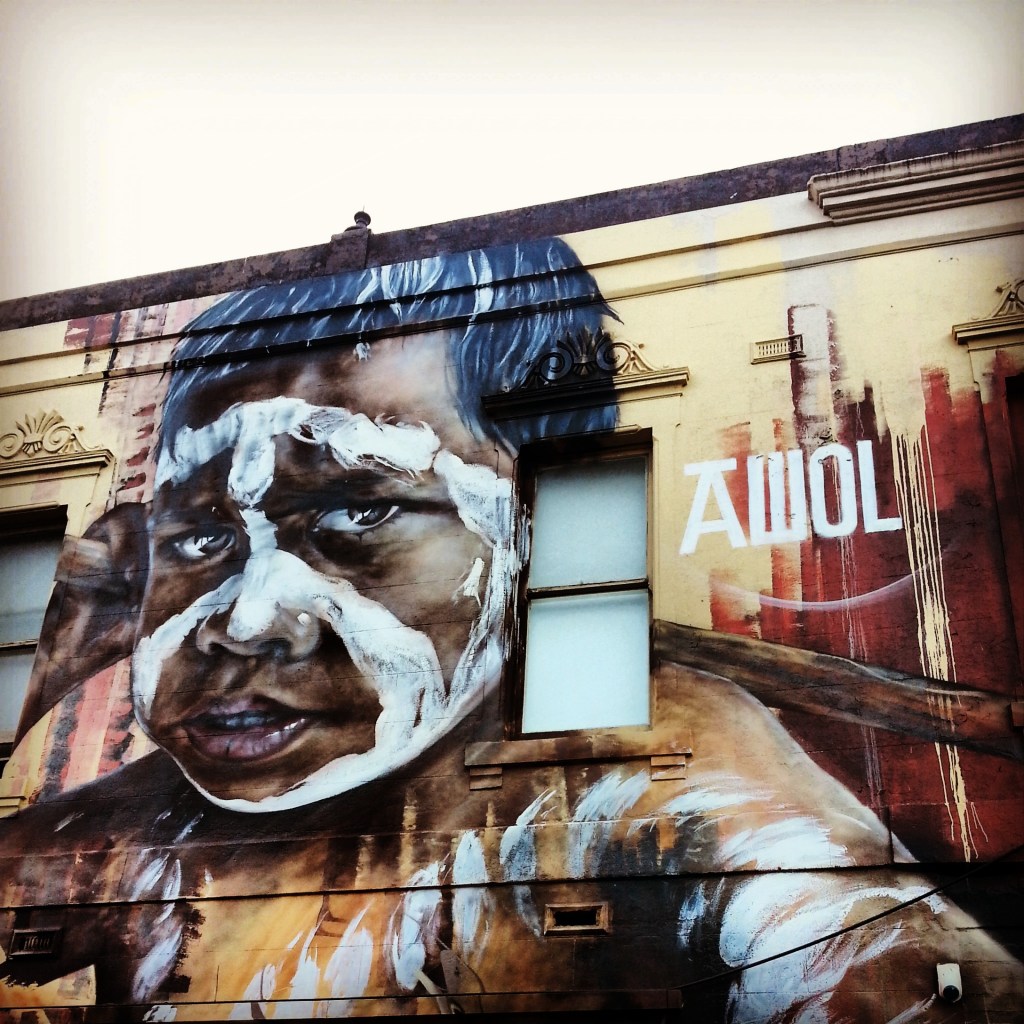 Street art of an Aboriginal child painted for ceremony