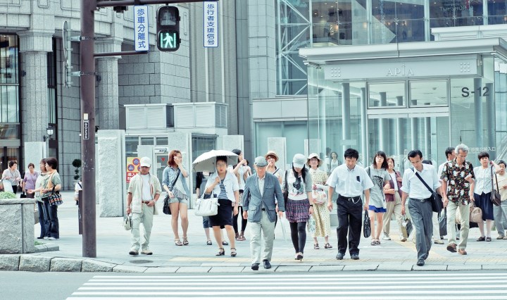 People walk across the road in Japan