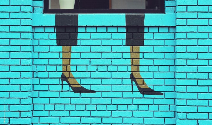 Street art on a wall showing high heels