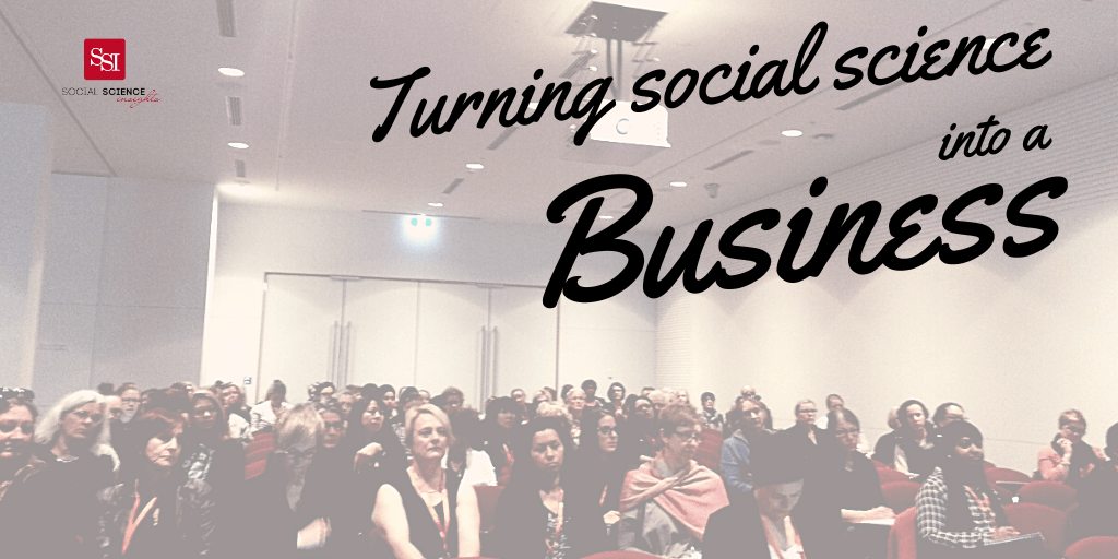 A crowd sits in a lecture room. Text reads: turning social science into a business