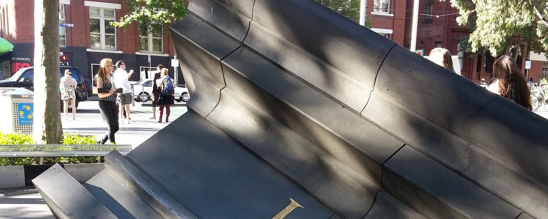 Sculpture of the top of a library, collapsed