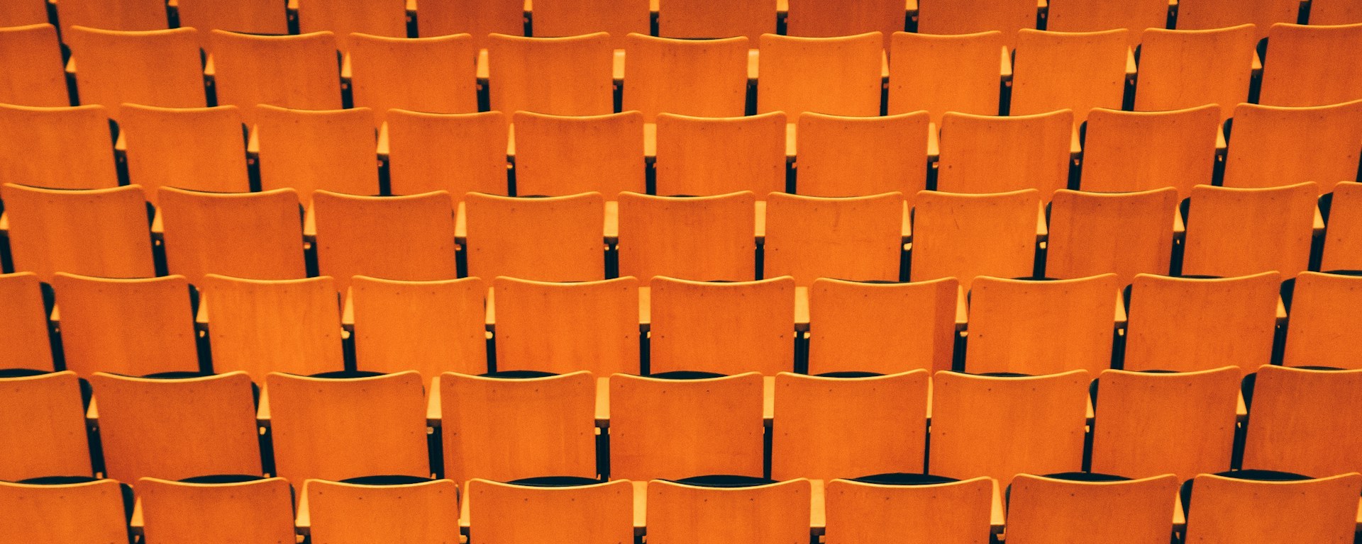 Large theatre with orange seats