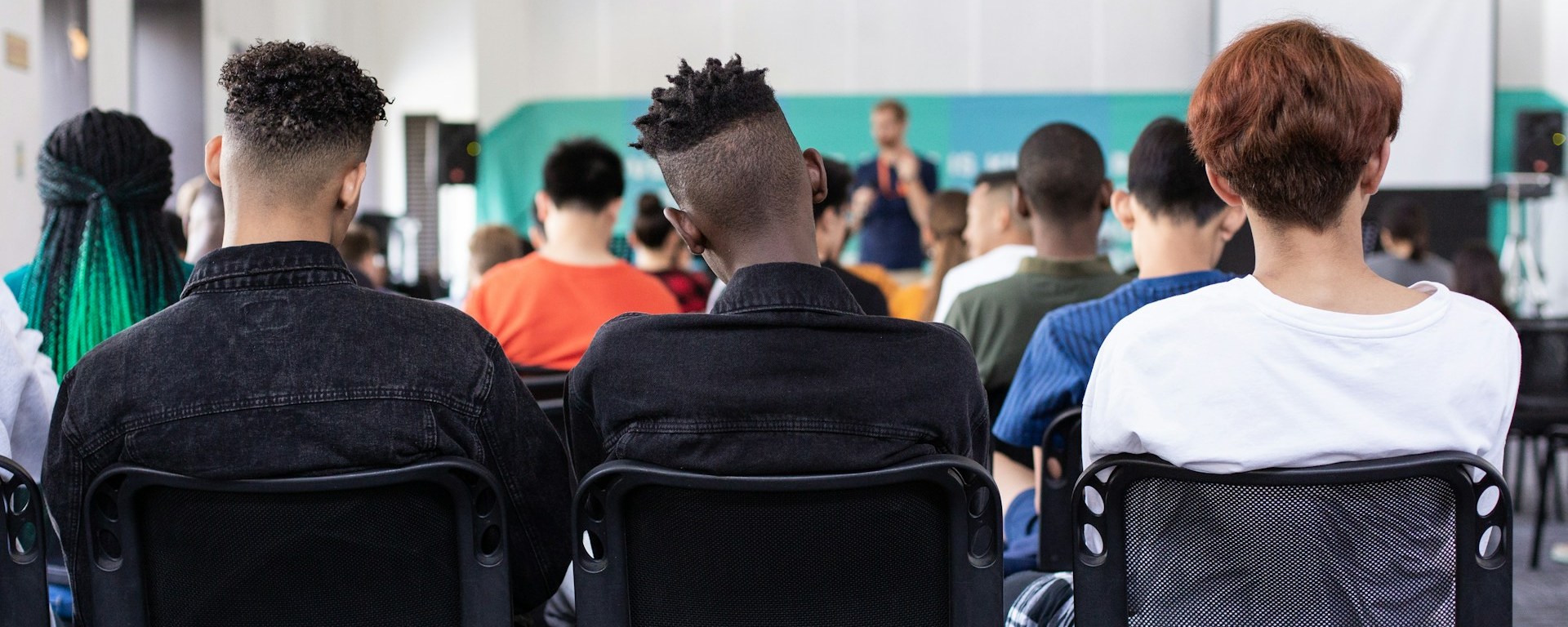 The backs of students in a classroom