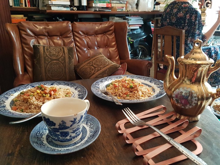 Ornate tea cut and food on a table