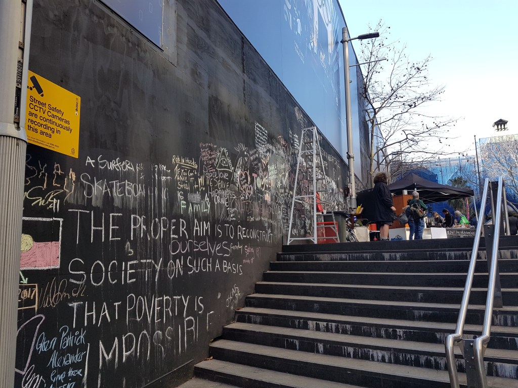 Chalk drawings by stairs leading to Martin Place. 