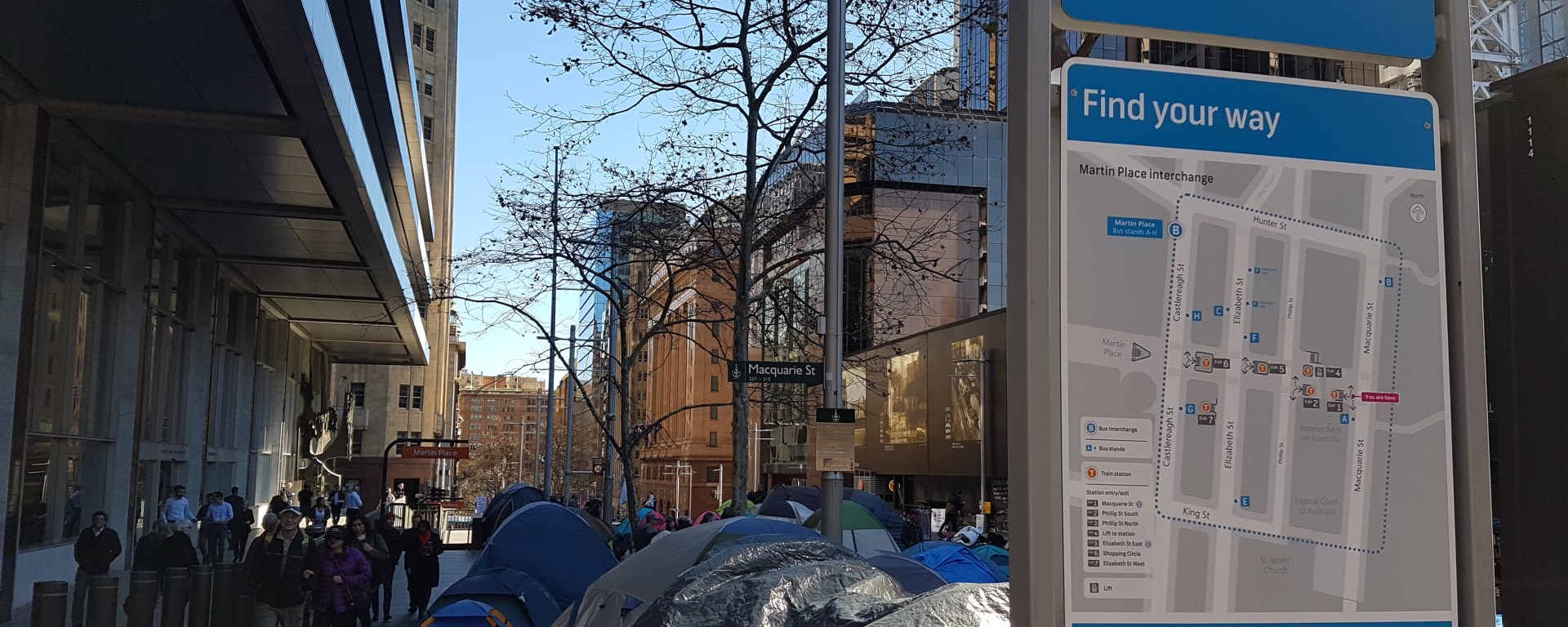 Tents placed outside the Martin Place sign