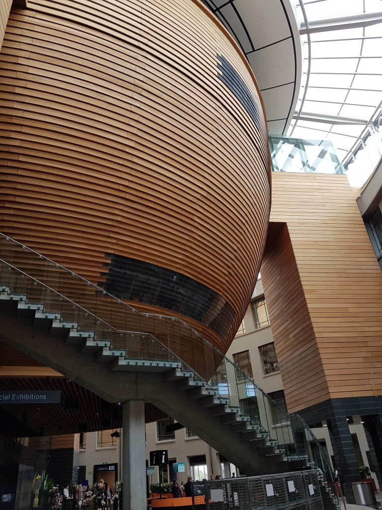 Inside of the Auckland Museum, there is a large cylindrical sphere and stairs