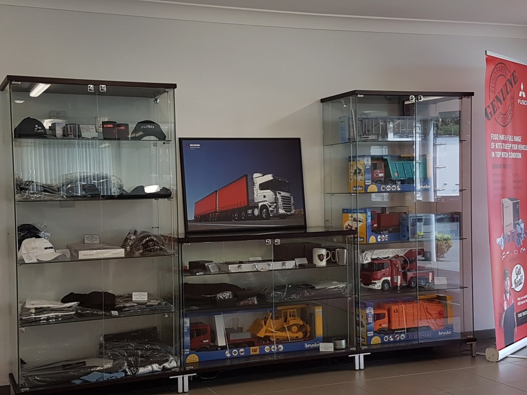 Glass cabinet showing model trucks
