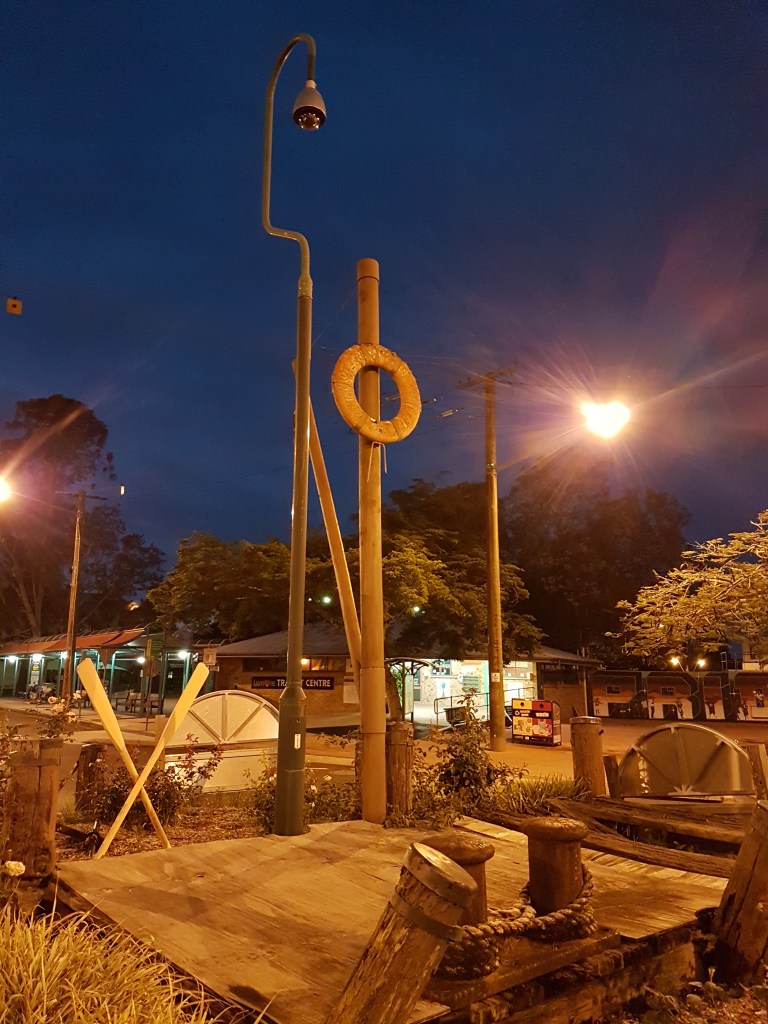 Lifebuoy statue in the centre of Lismore, at night