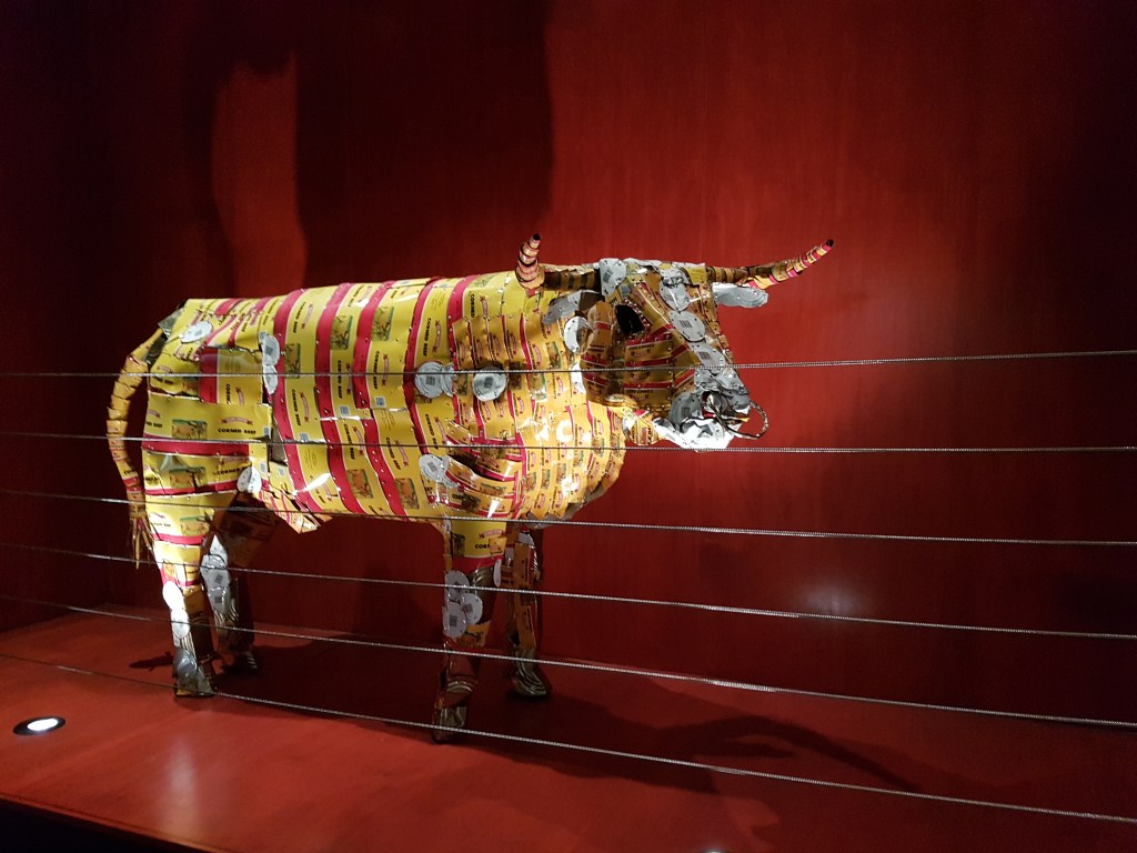 Artwork, 'Pisupo lua afe (Corned beef 2000),' by sculptor, Michel Tuffery. Artwork of a bull made up of corned beef cans, part of the 'Colonialism - all bull' exhibition.