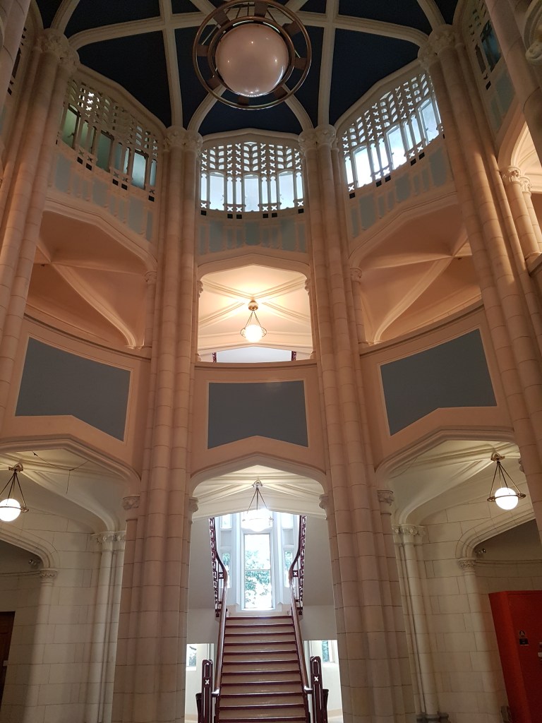 Roof of the Clock Tower, at the University of Auckland. Ornate light fixtures and white panels