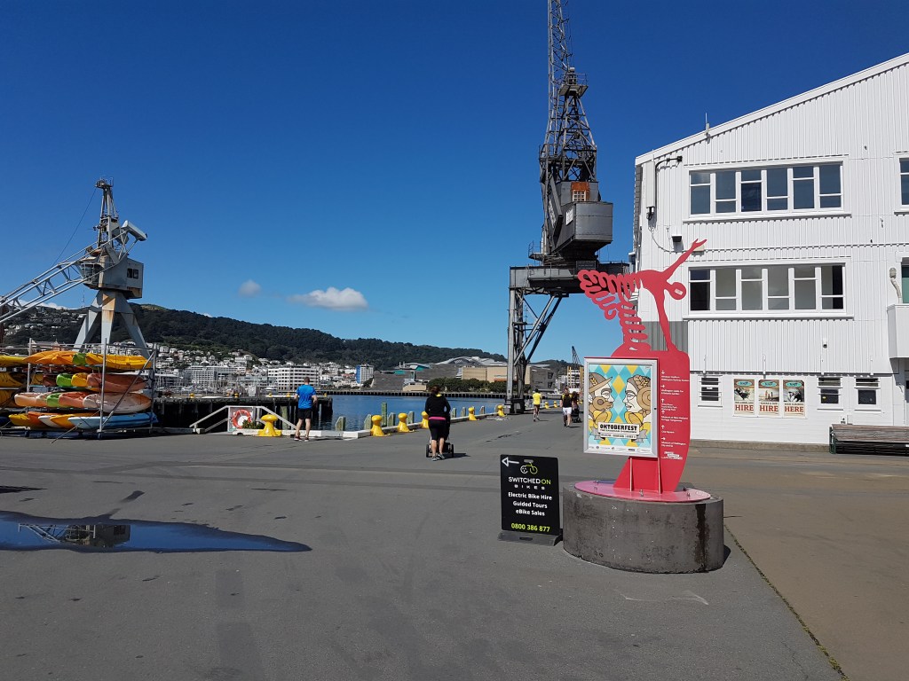 Red sculpture of humanoid figures in red