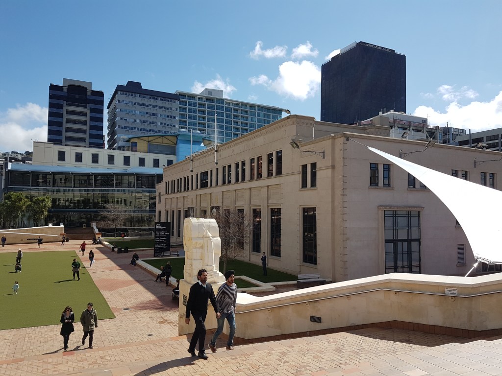 People walk up a ramp leading to the library