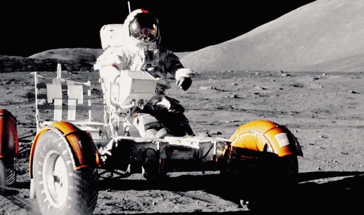 Astronaut riding a vehicle in space