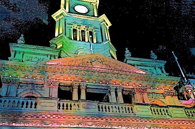 Building in Sydney lit up for Vivid, in bright lights, at night