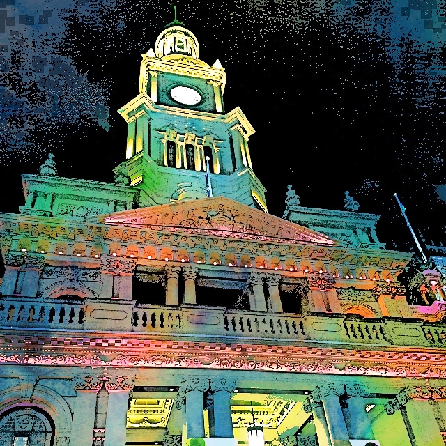 Building in Sydney lit up for Vivid, in bright lights, at night