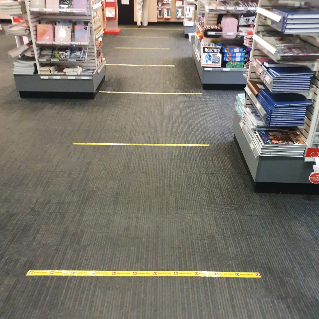Yellow lines mark where people should stand at the Post Office