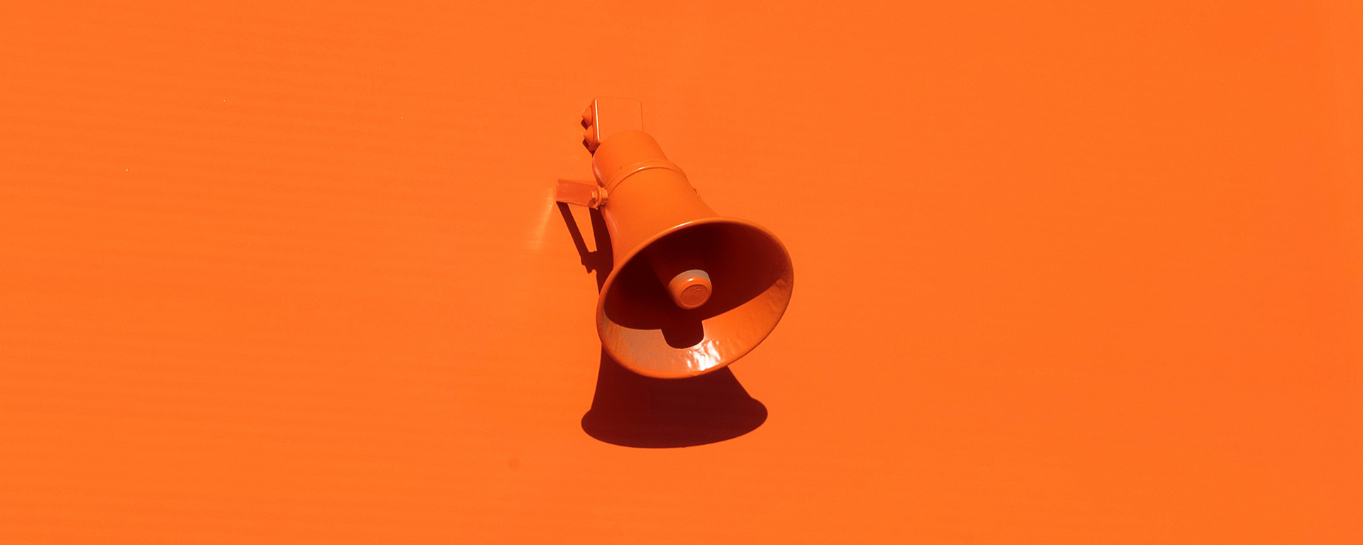 Orange wall with orange megaphone