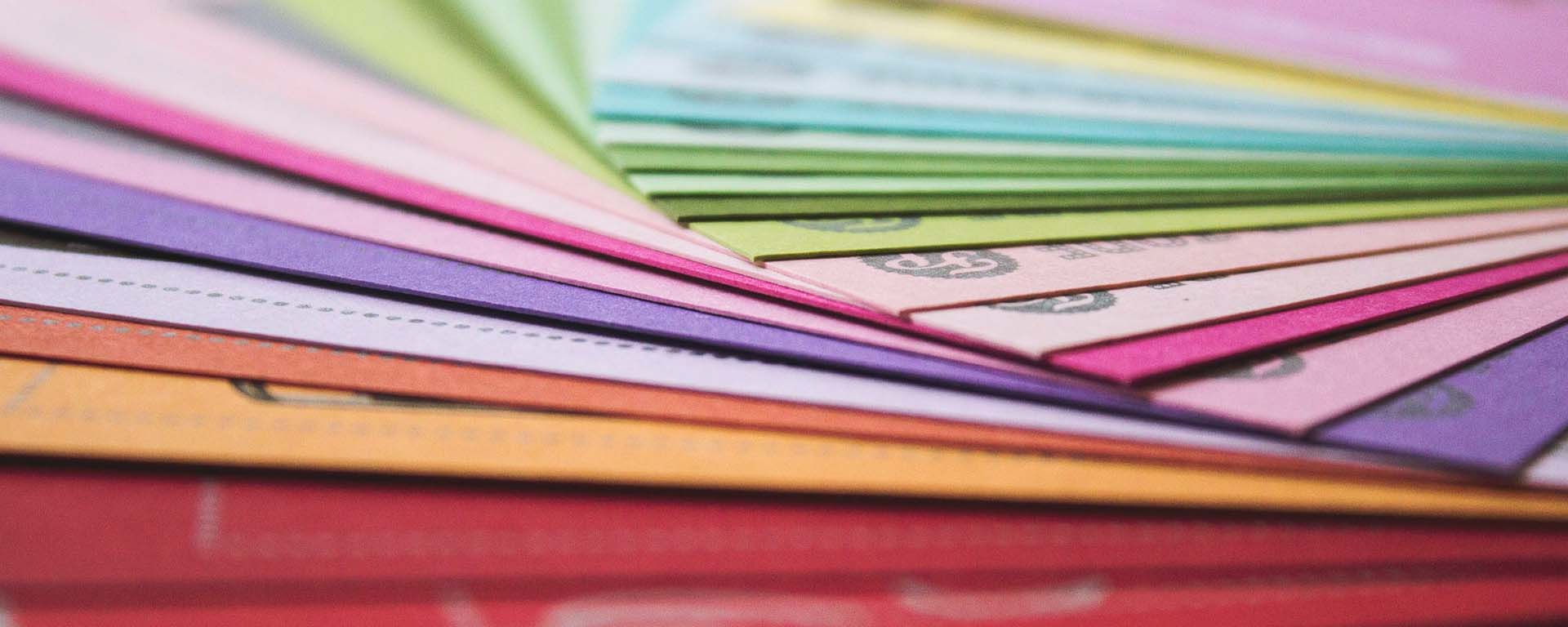 Stack of brightly coloured papers