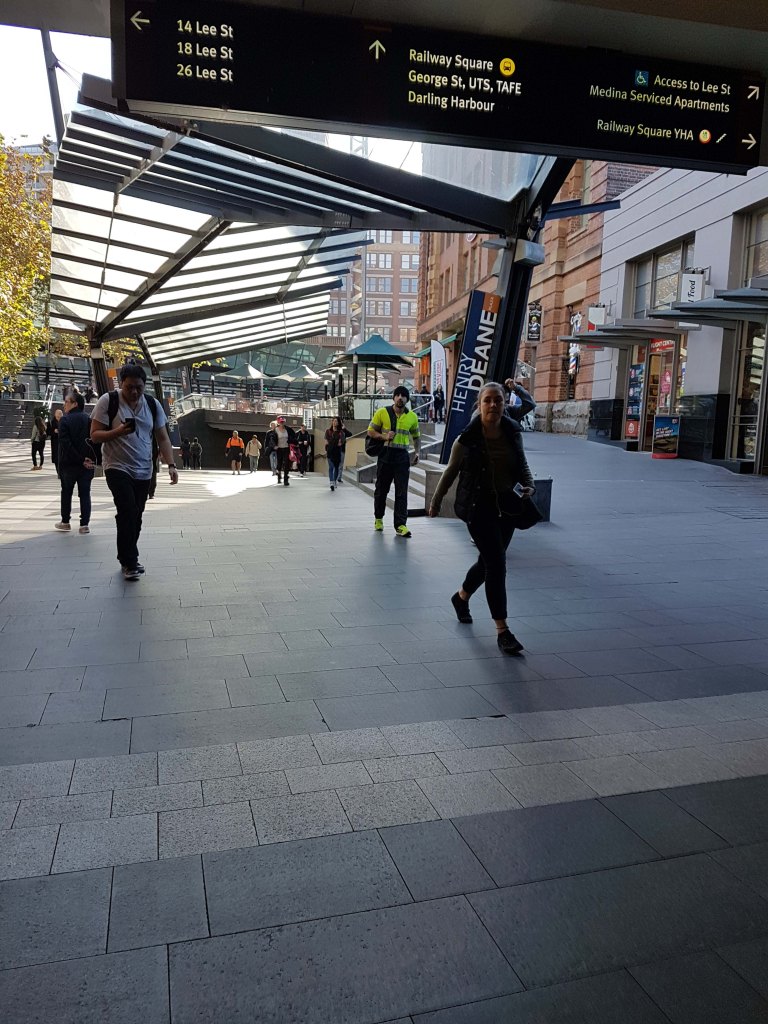 People walking at Henry Deane Square, in Sydney