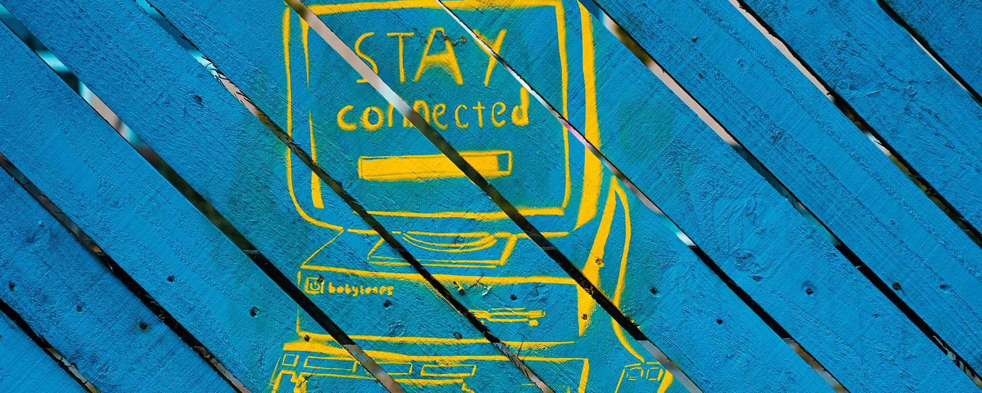 Blue boards with a drawing of an old computer. Text says: Stay conected