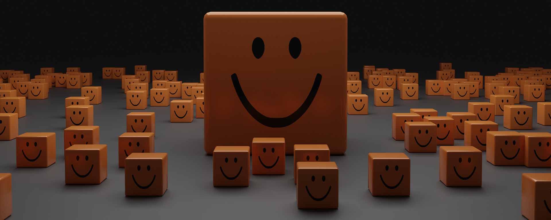 Many small blocks of wood, with one large wood rectangle in the centre. They all have a smiley face drawn on them