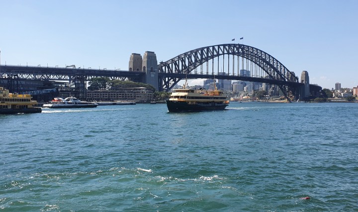 The ferry sails by the Sydney Harbour Bridge