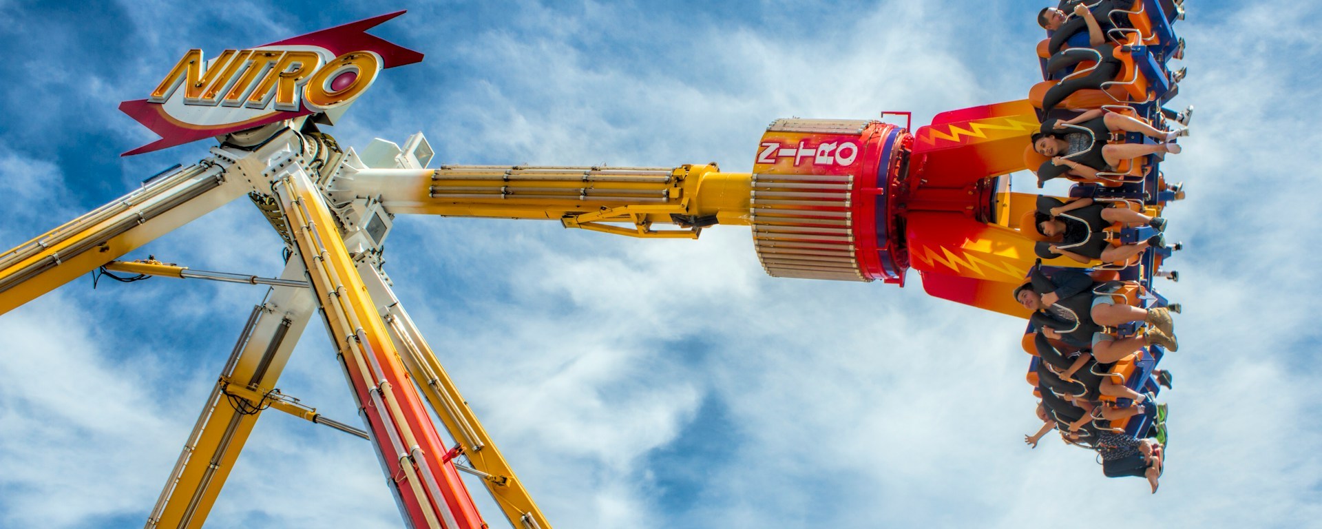 People swinging mid-air in the 'Nitro,' a carnival ride at the Perth Royal Show