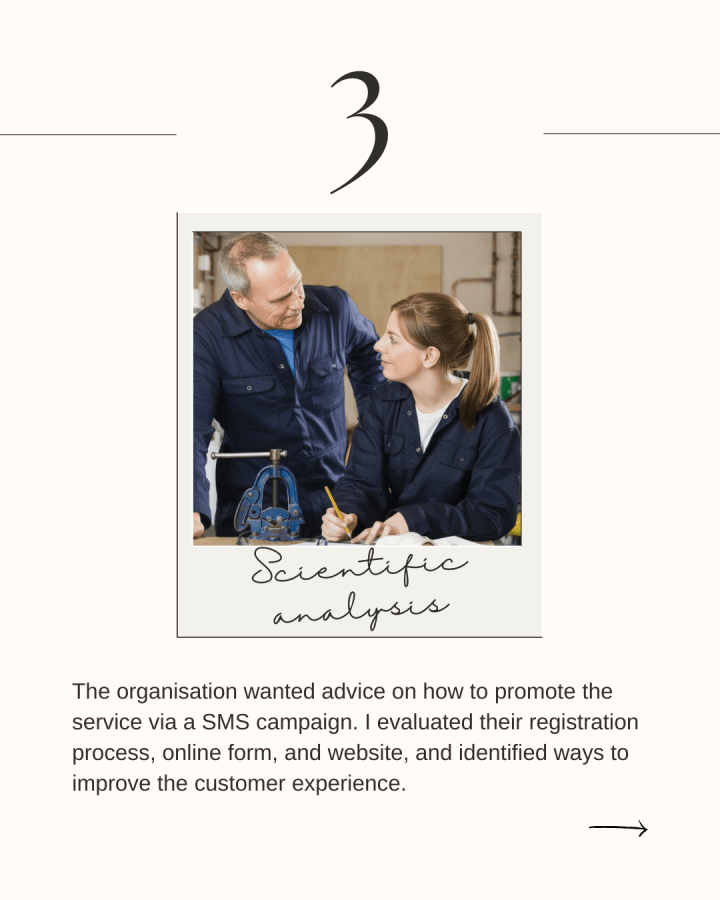 An older white man and a younger white woman wearing boiler suits smile at each other