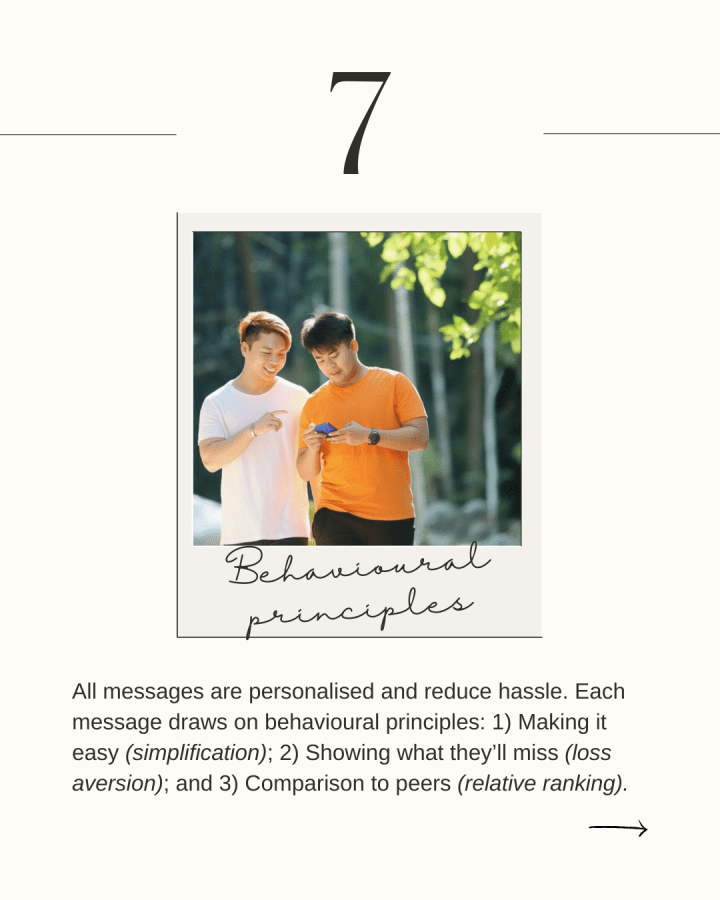 Two Asian men look at a phone as they walk outdoors